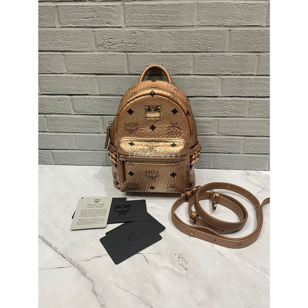 Mcm backpack rose gold best sale